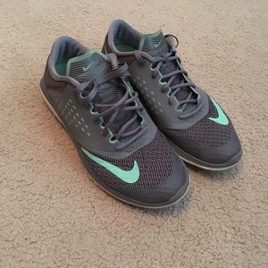 Dark grey and teal Nike running shoes